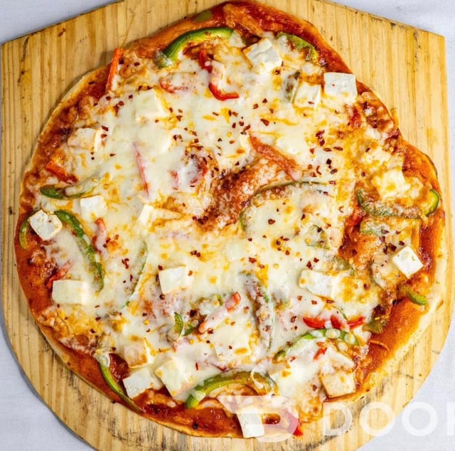 14” Makhani Pizza.